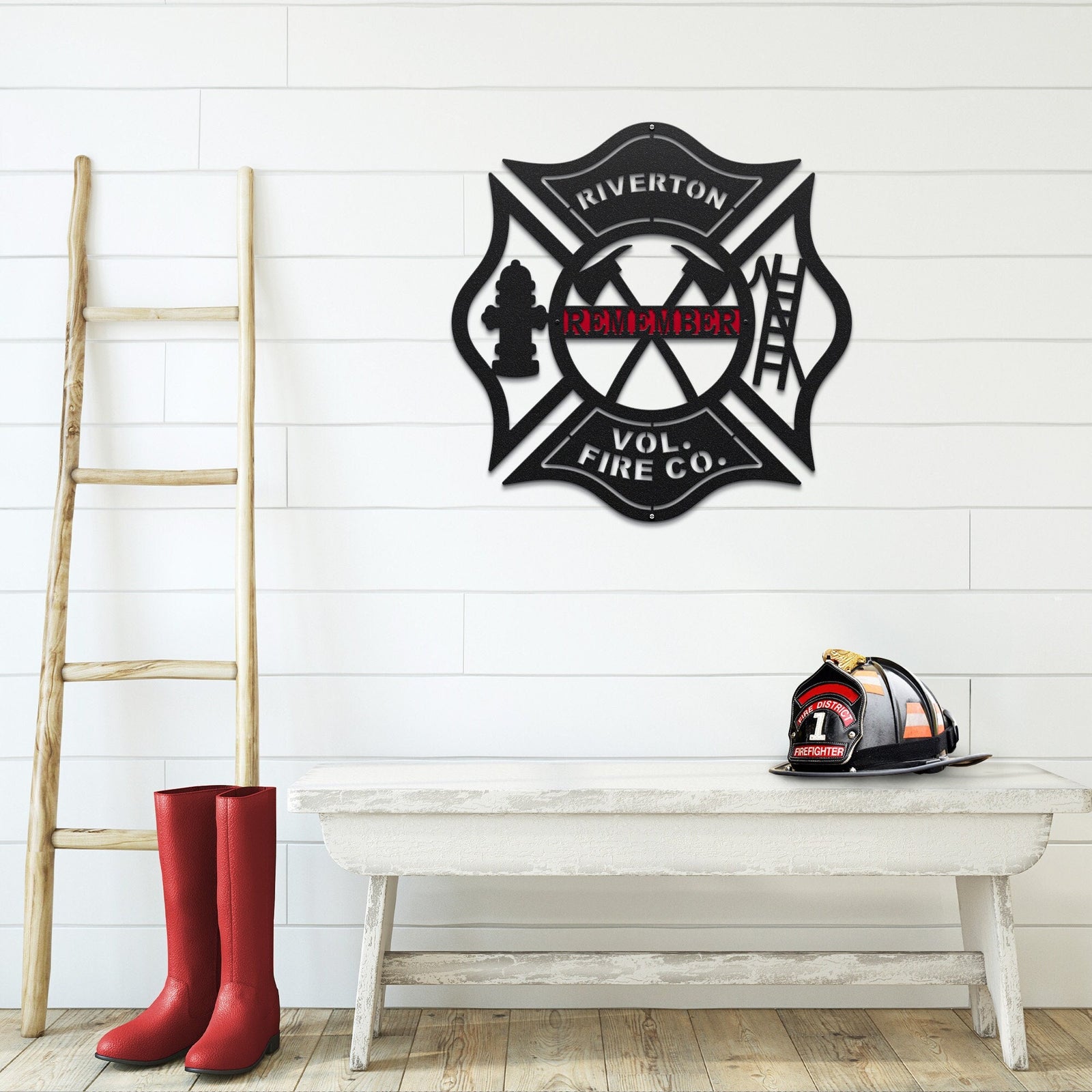 Wall art metal sign of Fire department emblem with personalized name on a white brick wall background
