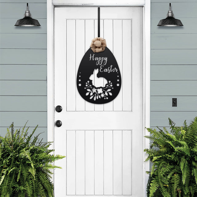Egg-shaped metal Easter sign with floral designs and “Happy Easter” greeting, spring farmhouse door wreath