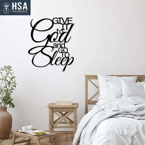 A metal sign that says "Give it to God and go to Sleep"