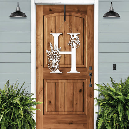 White “H” Metal Floral Monogram Door Wreath – elegant letter sign with flower details for custom entryway design.