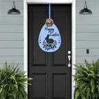 Black front door with light blue Easter egg bunny metal sign, matching blue wall background, seasonal farmhouse décor, custom powder coated welcome entry wall art sign