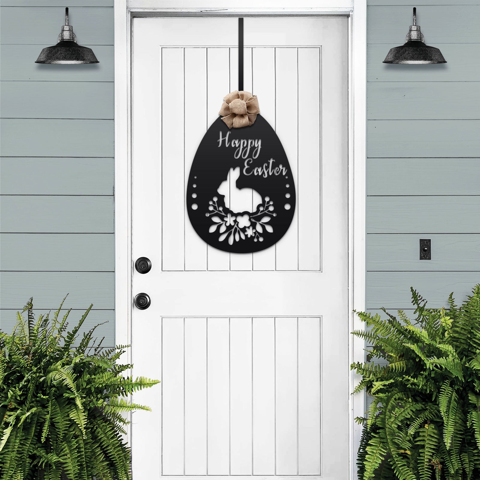 White front door with black Easter bunny metal welcome sign, light blue exterior backdrop, seasonal farmhouse décor, custom powder coated entry wall art sign