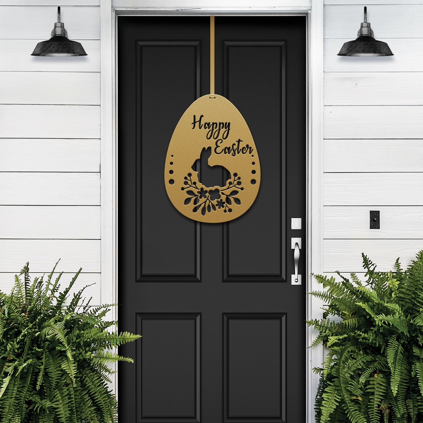 Gold Easter egg metal door sign on black door, white siding exterior with green plants, custom powder coated seasonal décor, farmhouse entry welcome accent sign