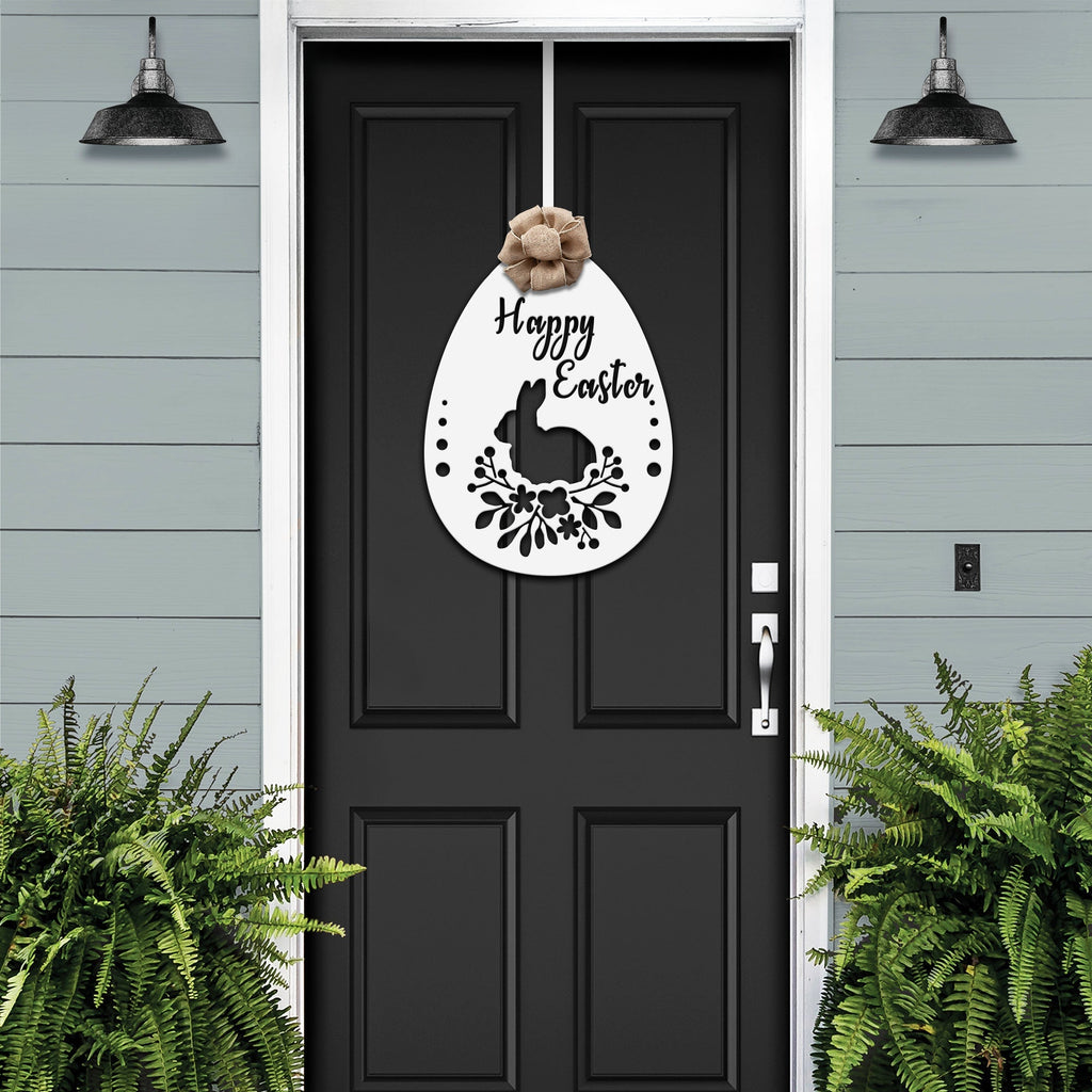 Black front door with Easter bunny metal egg wreath sign, light blue wall background, seasonal farmhouse entry décor, custom powder coated welcome wall art sign