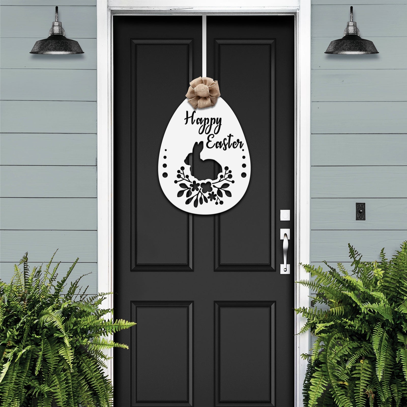 Black front door with Easter bunny metal egg wreath sign, light blue wall background, seasonal farmhouse entry décor, custom powder coated welcome wall art sign