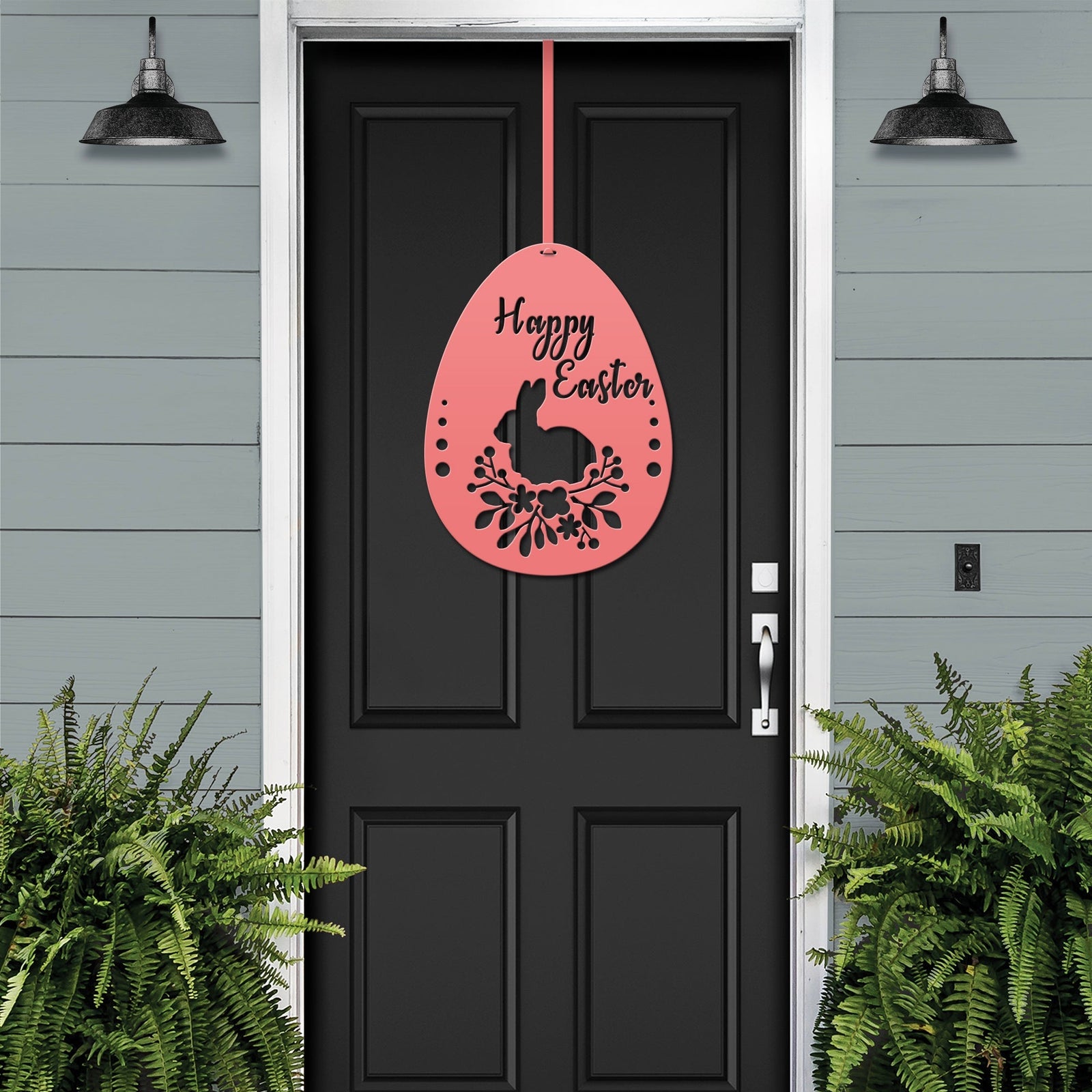 Black front door with pink Happy Easter egg metal sign, green plants exterior, seasonal farmhouse entry décor, custom powder coated welcome wall art sign