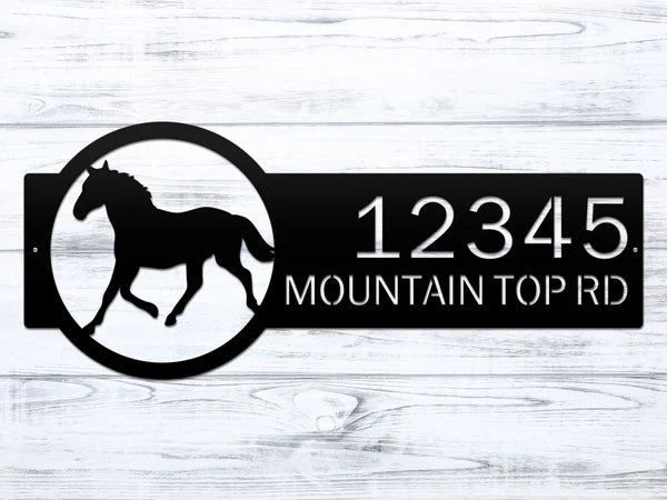 Close up Black metal address sign with a  horse silhouette on the right and the custom address '12345 Mountain Top Rd' in bold, rustic lettering for outdoor use.