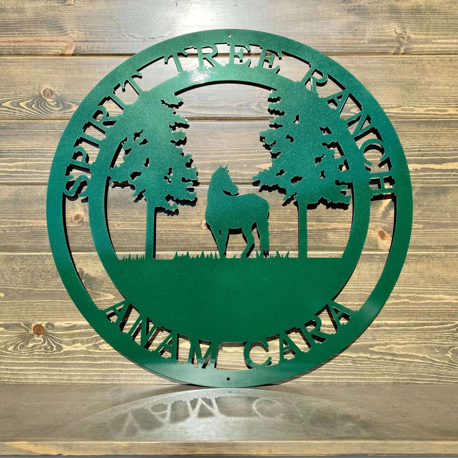 Emerald green custom horse tree sign laser cut metal ranch wall art showing horse beneath detailed tree silhouette.