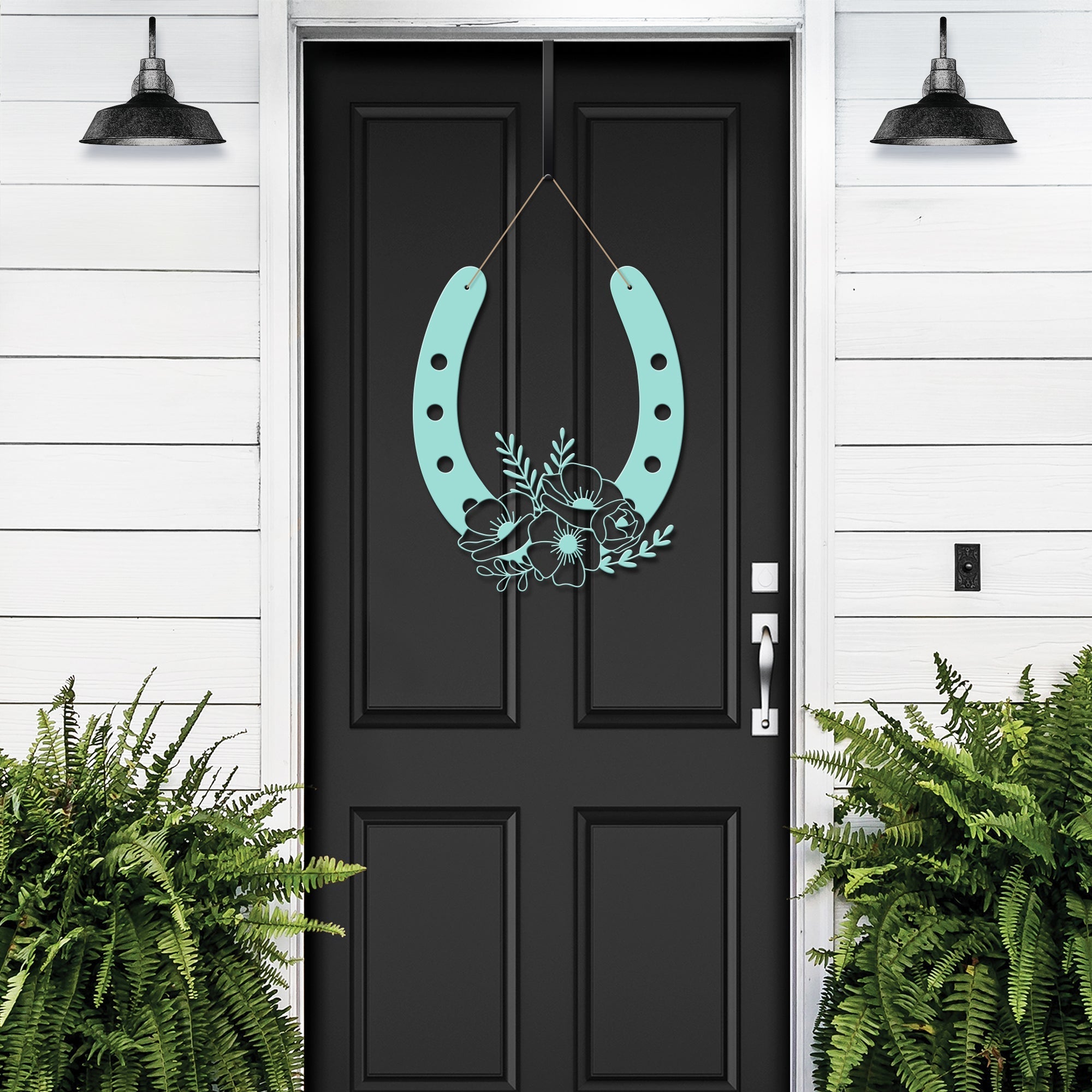Turquoise floral horseshoe metal wall art on black door with green plants, lucky farmhouse décor, decorative home gift sign