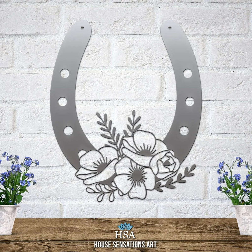 Silver floral horseshoe metal wall art on white brick wall, lucky farmhouse décor, House Sensations Art HSA branded decorative home sign