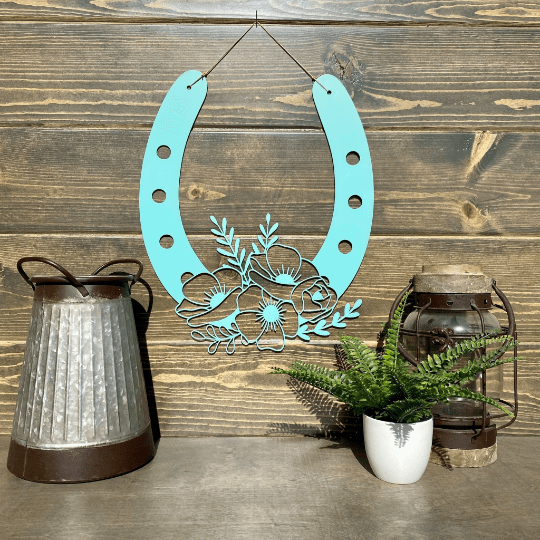 Decorative teal metal horseshoe with floral design on wood wall, rustic home décor, lucky horseshoe sign, farmhouse wall art, gift idea