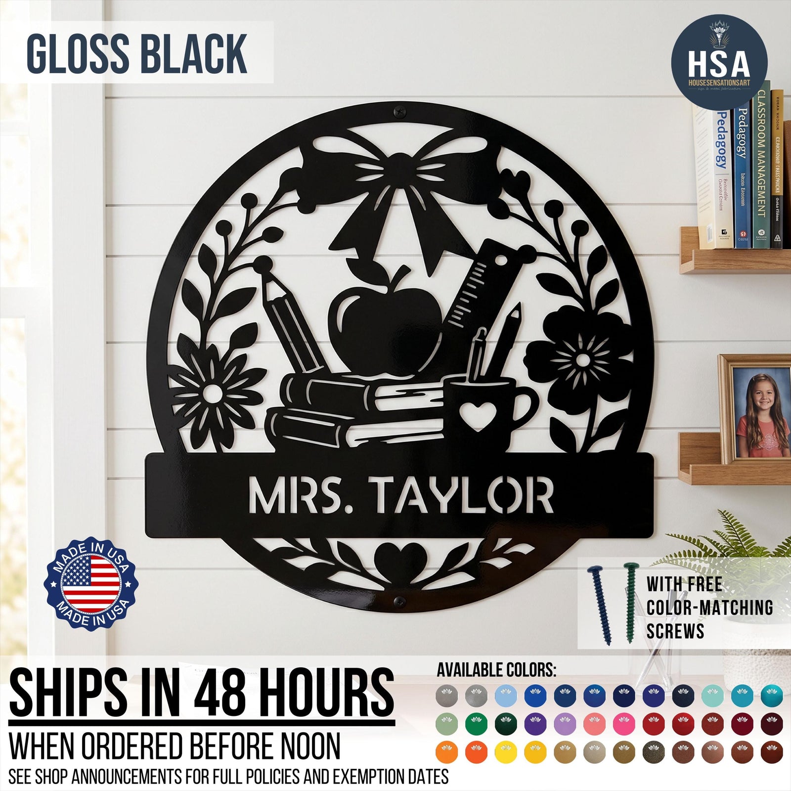 Introducing the Personalized Teacher Name Classroom Sign - a round custom metal sign shown in Satin Black displayed on a homeschool classroom wall. Features a beautiful collage of schoolbooks, teacher's apple, ruler, pencil in coffee mug, and ornate bow & flower, with personalized name plaque across the lower half. Featured photo reads Mrs. Taylor. Sign comes with color-matching screws and is available in more than 50 color finishes