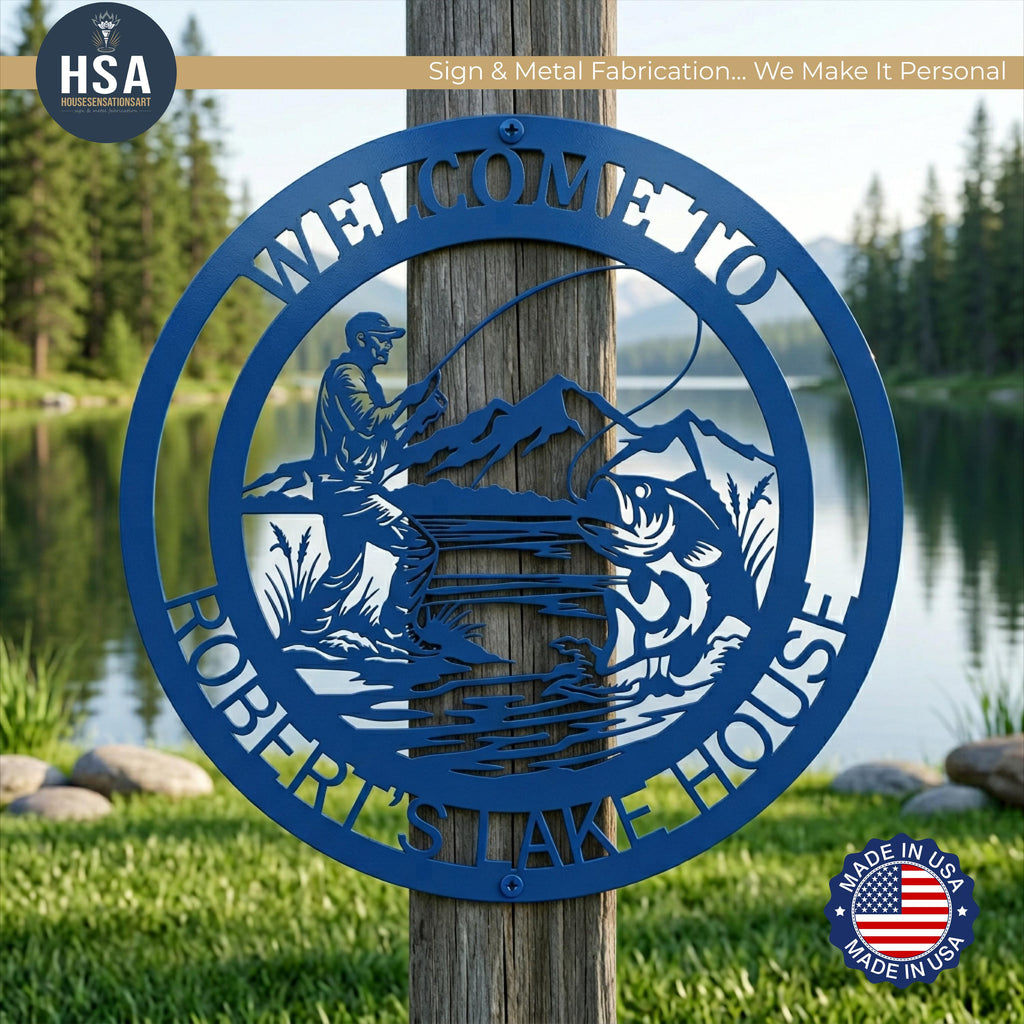 Introducing HSA's Pro Angler Custom Metal Sign - a round metal sign featuring a dynamic fishing scene showcasing a fisherman in action, casting his line as a large fish leaps from the water, creating a strong sense of movement and excitement. This circular sign is shown in Panther Blue and is mounted on a wooden pole outside of a lake house with beautiful lake background.