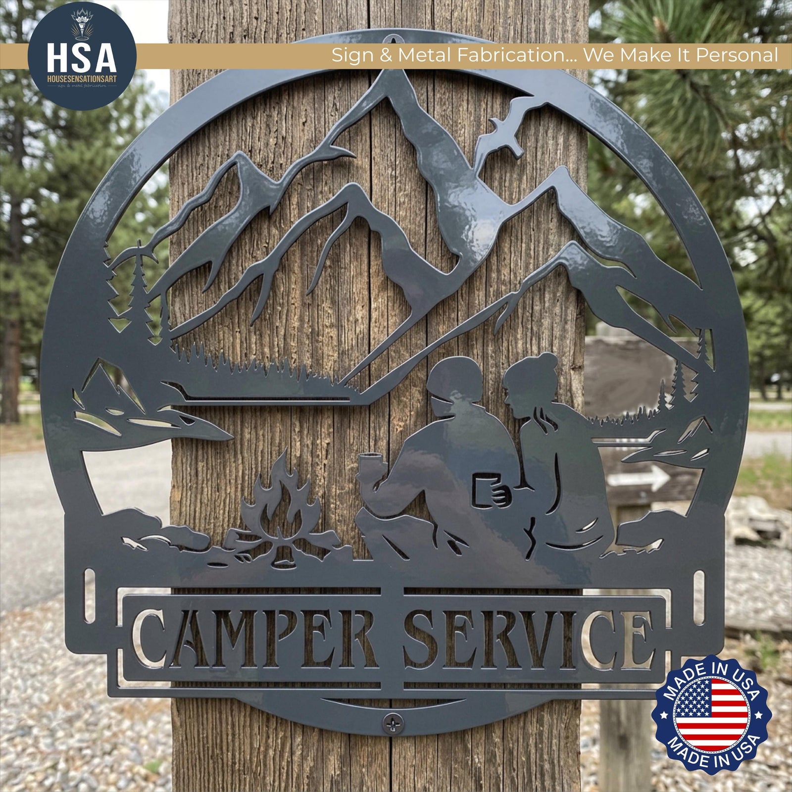Round metal custom camper sign, trailer name plate RV decor with mountains, trees, lake, and a couple by a campfire.