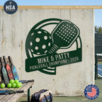 Large outdoor pickleball paddle sign shown on outdoor concrete wall, perfect for any pickleball couple. Pictured example is shown in Bionic Green in the 48" x 48" size.