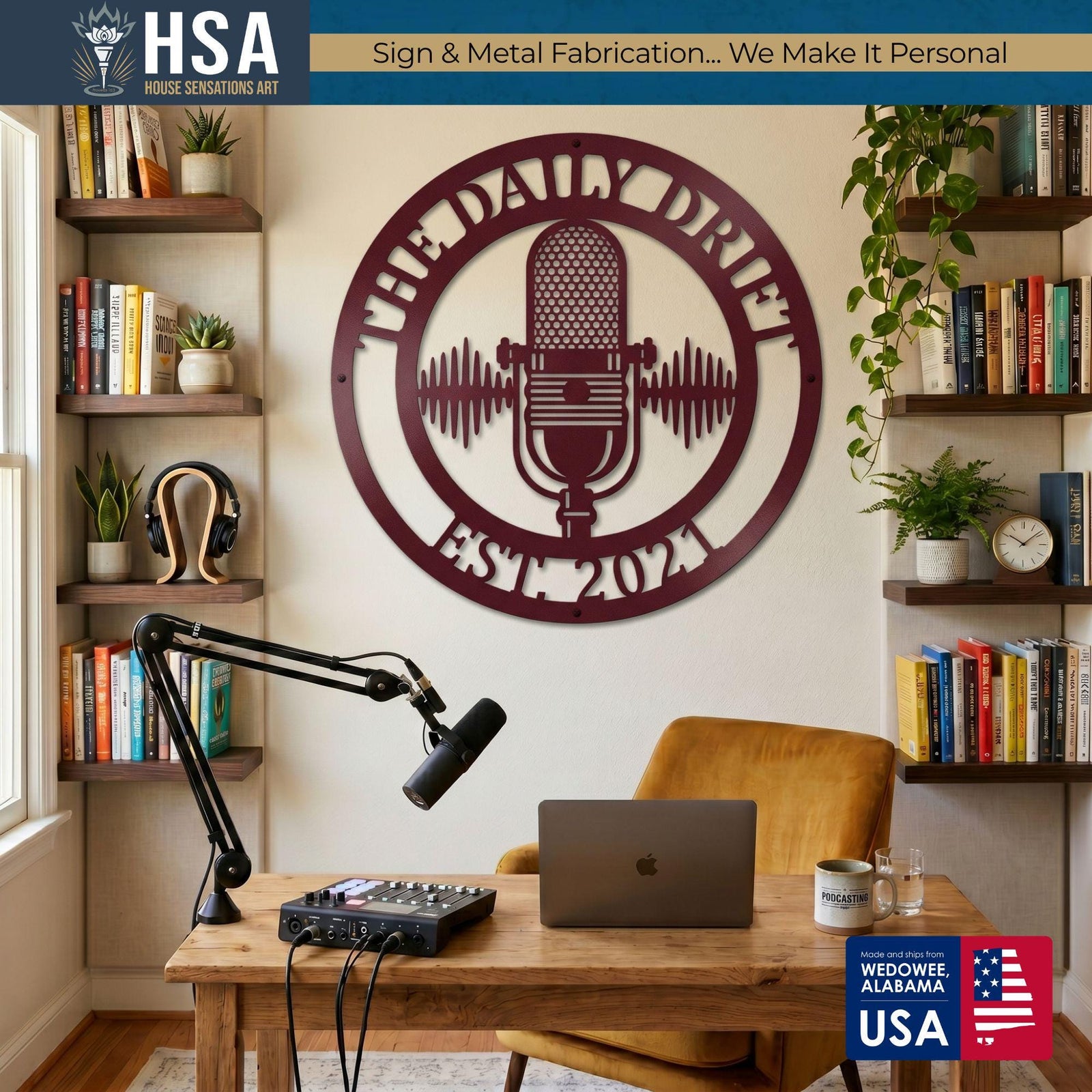 Personalized metal wall art sign featuring a podcast mic, EST 2021, for content creator, mounted above a wooden desk in a studio.