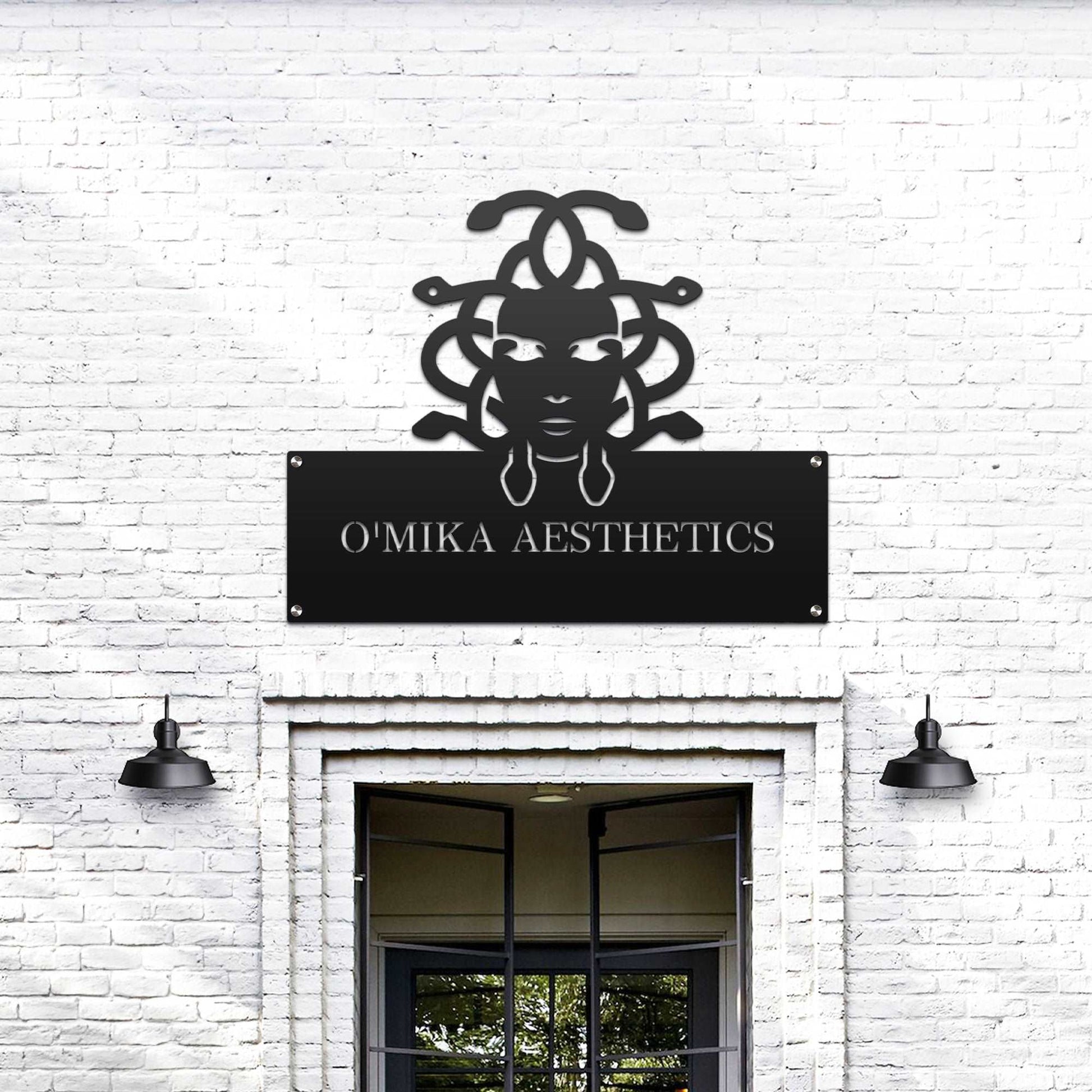 Large custom laser-cut metal business logo sign for “O'Mika Aesthetics” on a white brick wall, ideal for office and storefront décor, showcasing professional branding – House Sensations Art.