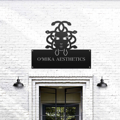 Large custom laser-cut metal business logo sign for “O'Mika Aesthetics” on a white brick wall, ideal for office and storefront décor, showcasing professional branding – House Sensations Art.