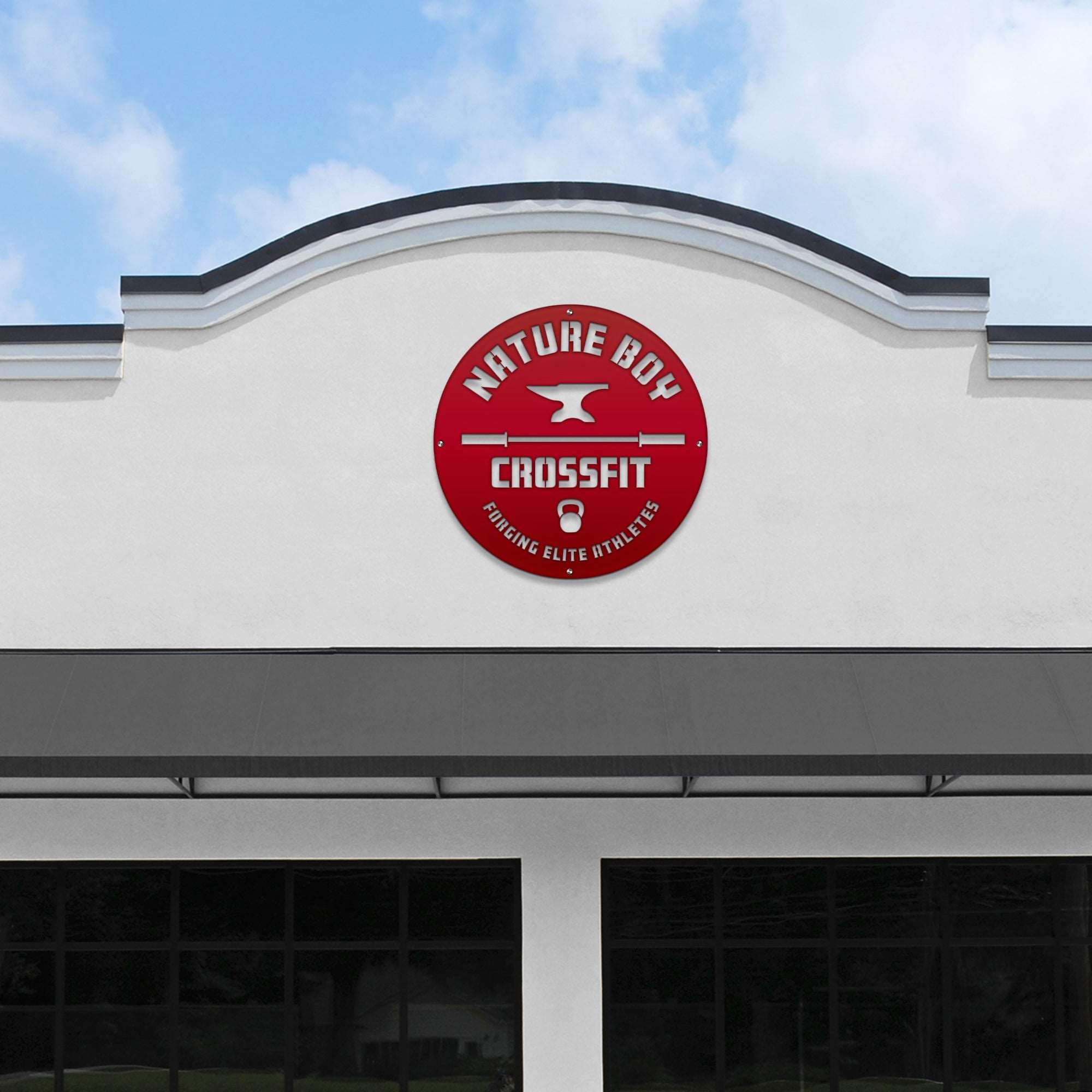 Large custom laser-cut metal business logo sign for “Nature Boy CrossFit” on a building facade under a clear blue sky, perfect for storefront and office branding – House Sensations Art.