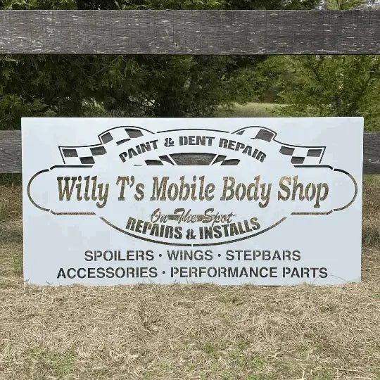 Willy T's Mobile Body Shop sign with checkered flags, listing repairs, installs, accessories, and paint/dent services.