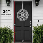 Decorative mandala door hanger, 24 inches in diameter, displayed on a black front door with white trim, showcasing intricate lotus-inspired design, durable metal craftsmanship, and clear size for scale.