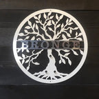 Brushed silver tree metal sign with personalized text, custom metal wall art on wood backdrop, modern rustic décor, powder coated outdoor sign design
