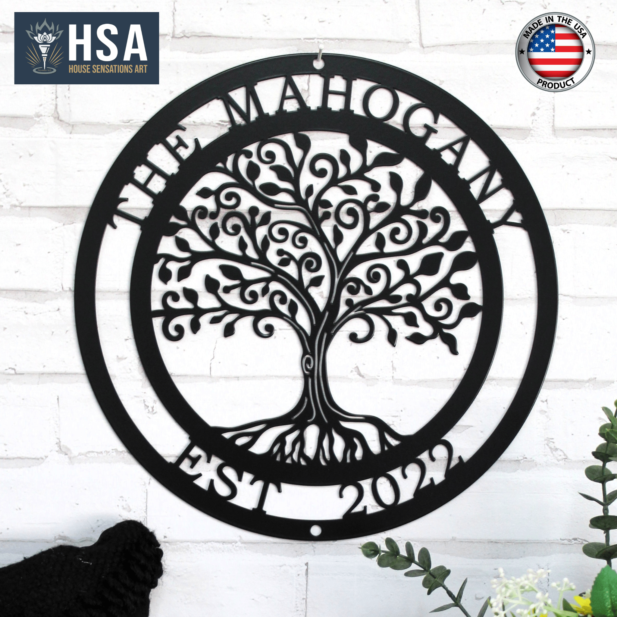 Personalized tree of life metal wall décor with intricate design, displayed on a white brick wall, featuring HSA branding, ideal for custom home décor and personalized gifts.