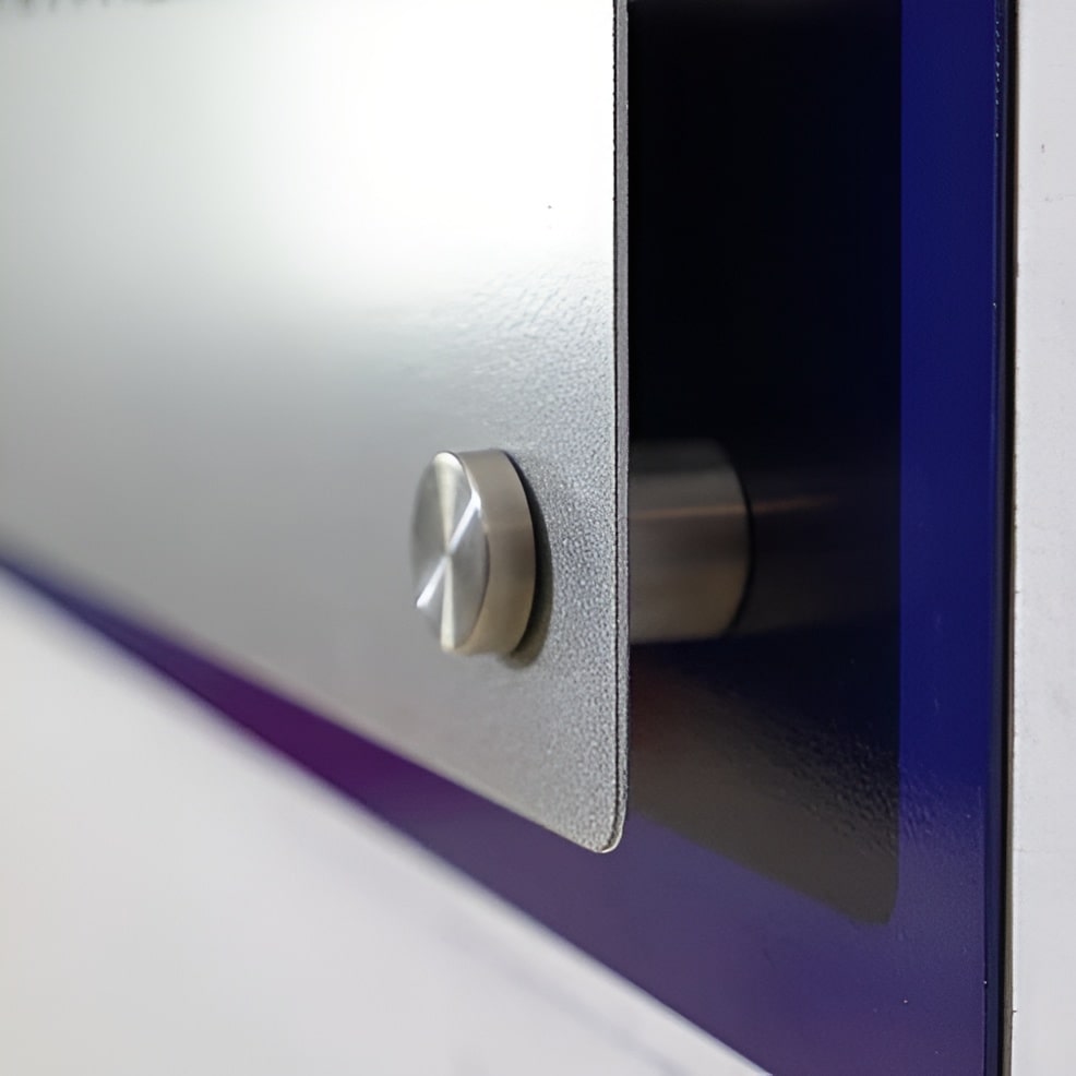 Close-up of a metal wall art piece mounted on a wall, showing the mounting hardware and detailing, highlighting sleek design and secure installation.