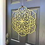Yellow floral mandala metal wall art on dark gray door, side view, custom powder coated farmhouse entry décor, elegant front door welcome sign design