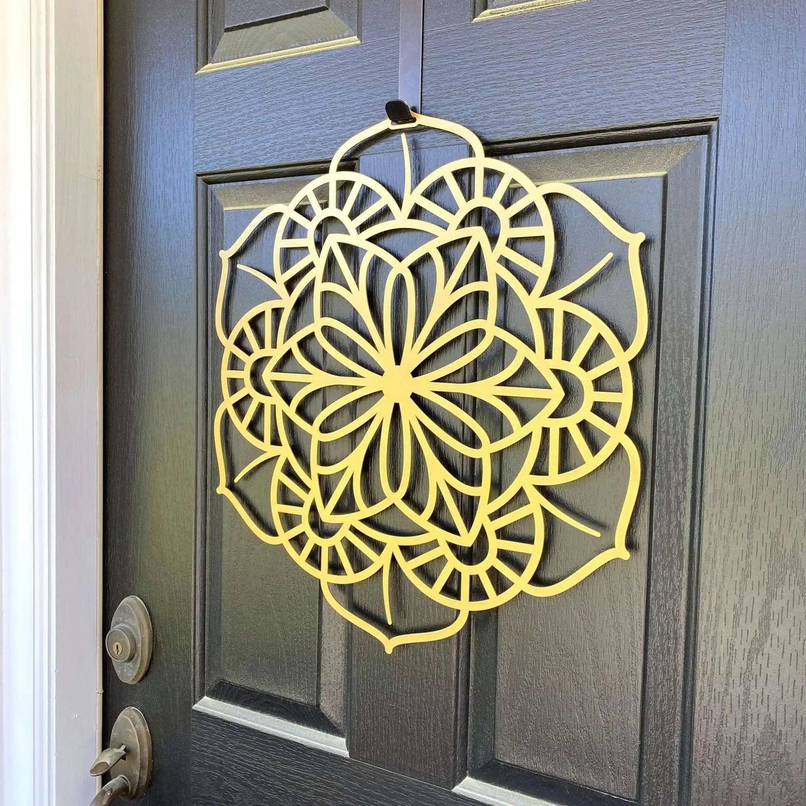 Yellow floral mandala metal wall art on dark gray door, side view, custom powder coated farmhouse entry décor, elegant front door welcome sign design