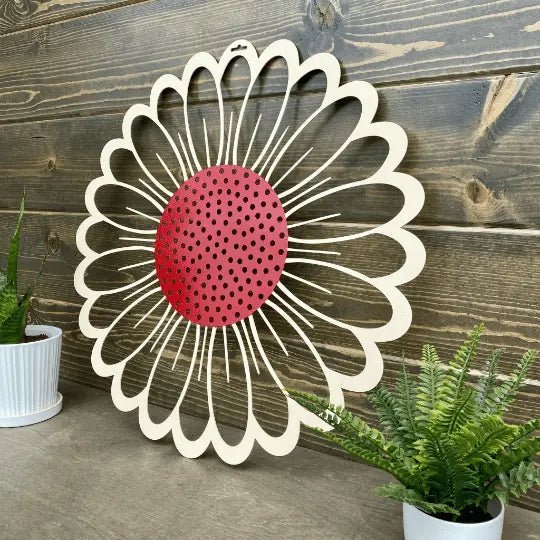 Side view metal flower wreath wall art with red center and white petals on wood backdrop, rustic farmhouse décor, custom powder coated metal sign, outdoor accent design