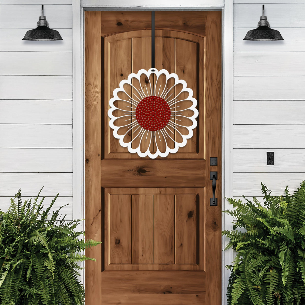 Wood front door with sunflower wreath metal design, rustic farmhouse entry décor, green plants exterior curb appeal, custom powder coated metal wall art accent