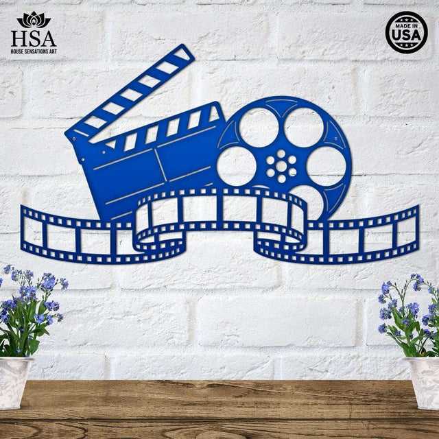 Metal movie reel wall art with film strip and clapboard cutouts, perfect for home theater or media room decor.