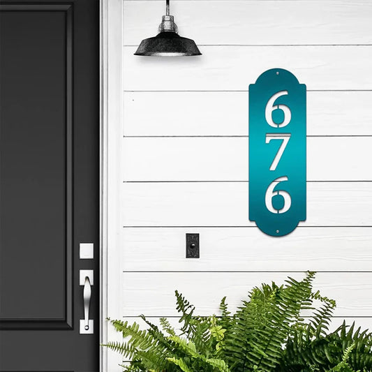 Vertical Modern House Numbers Sign in candy teal with number '676', mounted on door wall.