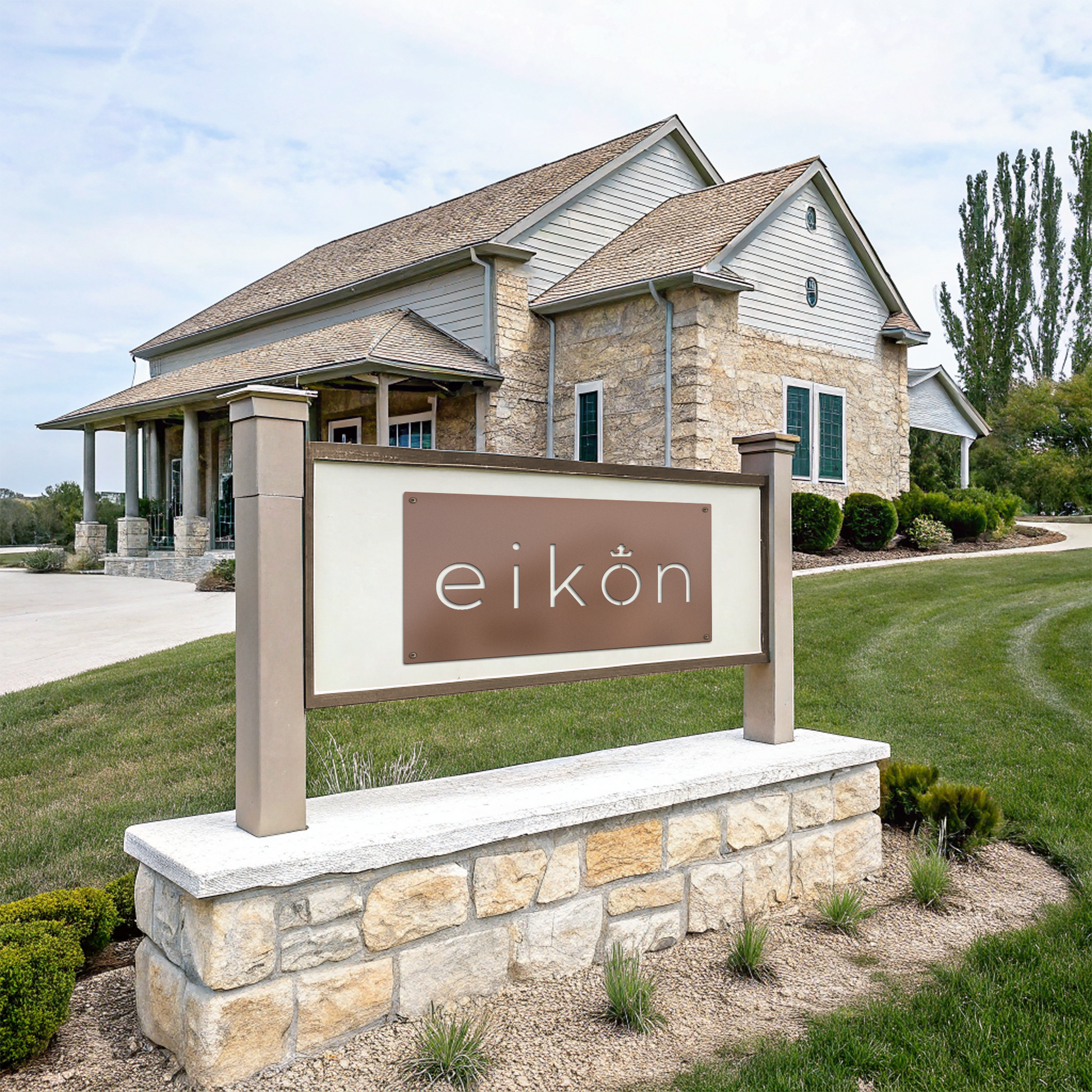 Outdoor metal monument sign designed for business use, featuring sleek metallic lettering and a sturdy base for professional branding.