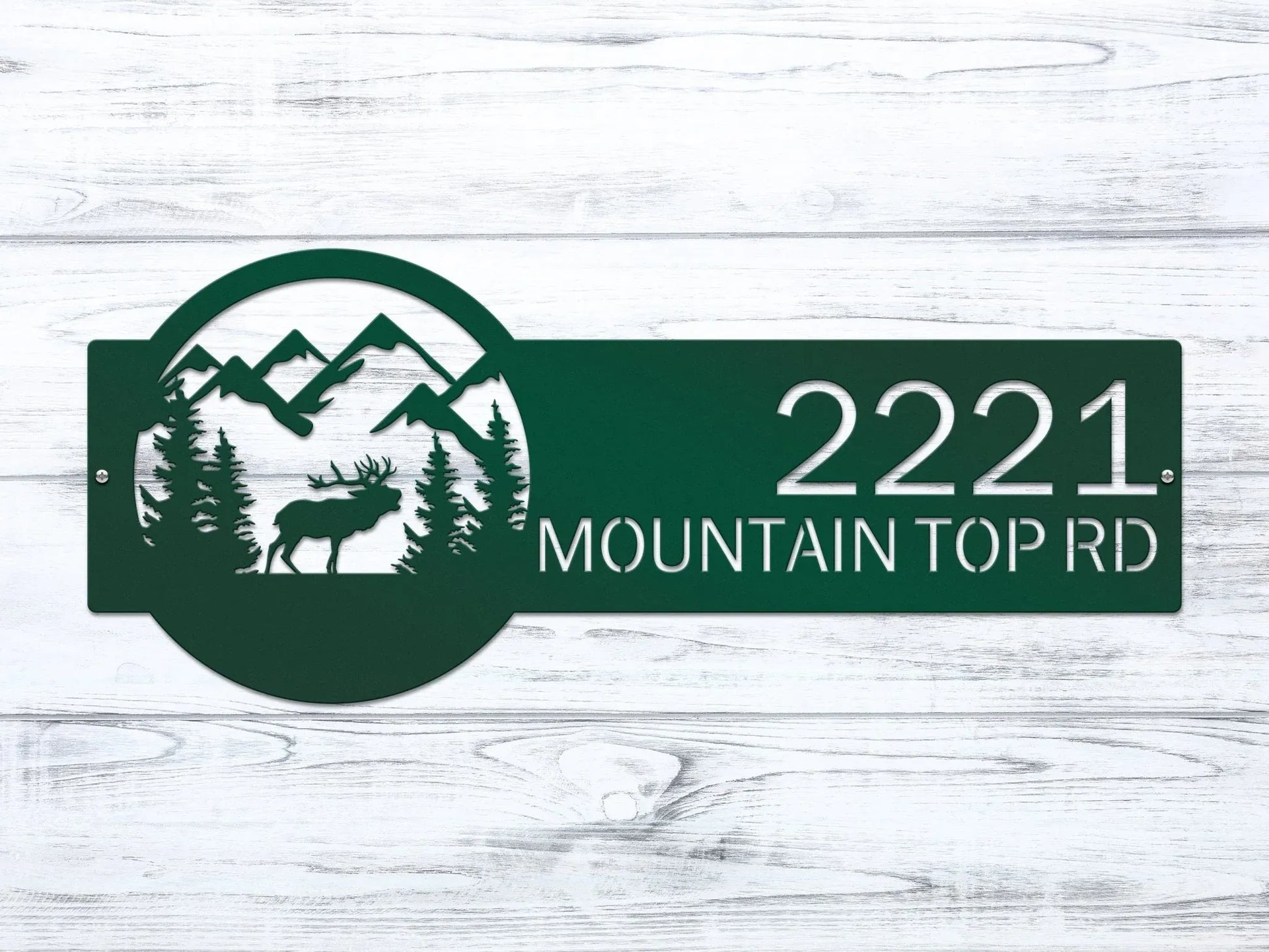 Close-up of Bionic green Mountain Elk Address Sign featuring elk, pine trees, and mountain on the right, with house number '2221 Mountain Top Rd' on the left.