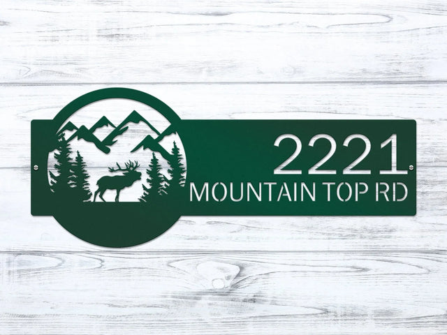 Close-up of Bionic green Mountain Elk Address Sign featuring elk, pine trees, and mountain on the right, with house number '2221 Mountain Top Rd' on the left.