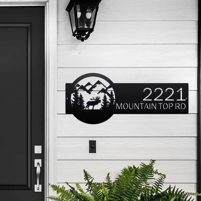 Black Mountain Elk Address Sign featuring elk, pine trees, and mountain on the right, with house number '2221 Mountain Top Rd' on the left, mounted on door wall.