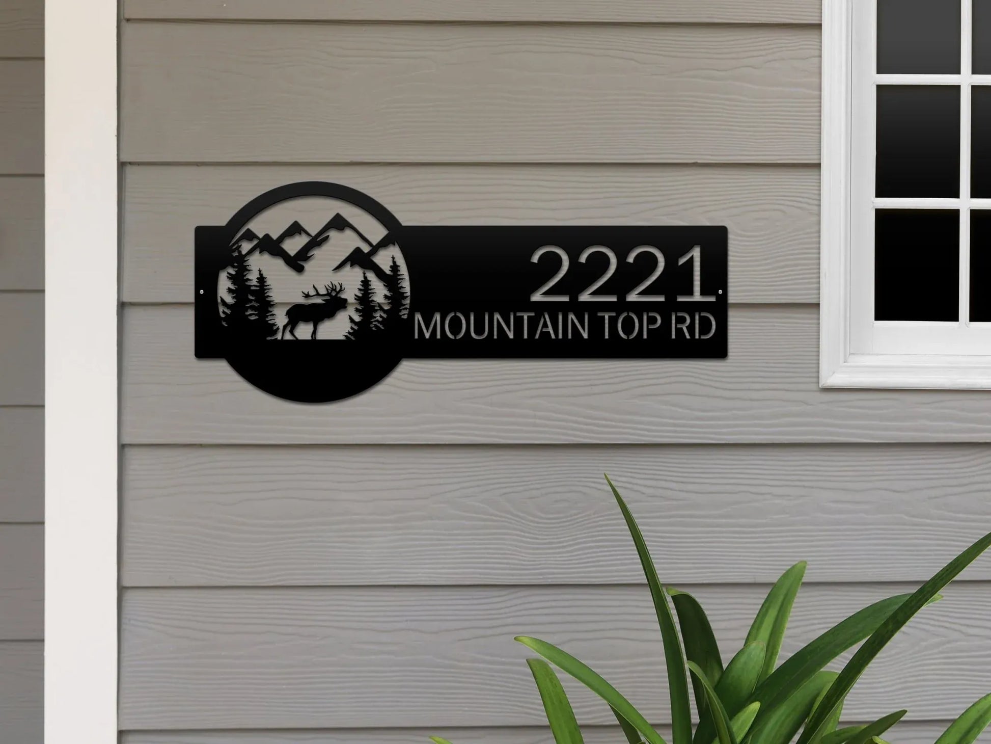 Black Mountain Elk Address Sign featuring elk, pine trees, and mountain on the right, with house number '2221 Mountain Top Rd' on the left, mounted on the door wall.