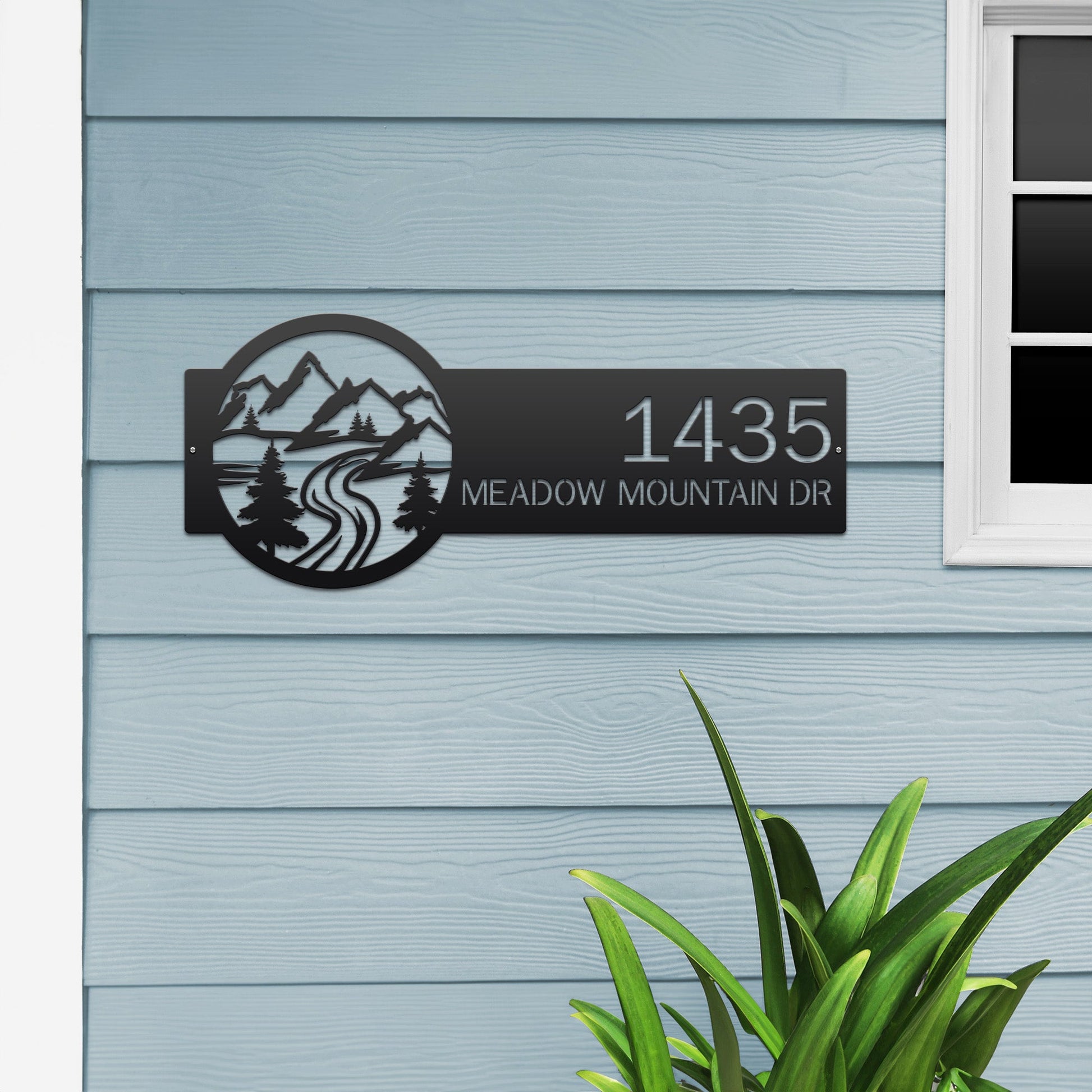 Gloss black Mountain Monogram Address Sign with mountain, pine tree, and  rode  on right, house number '1435 Meadow Mountain Dr' left.