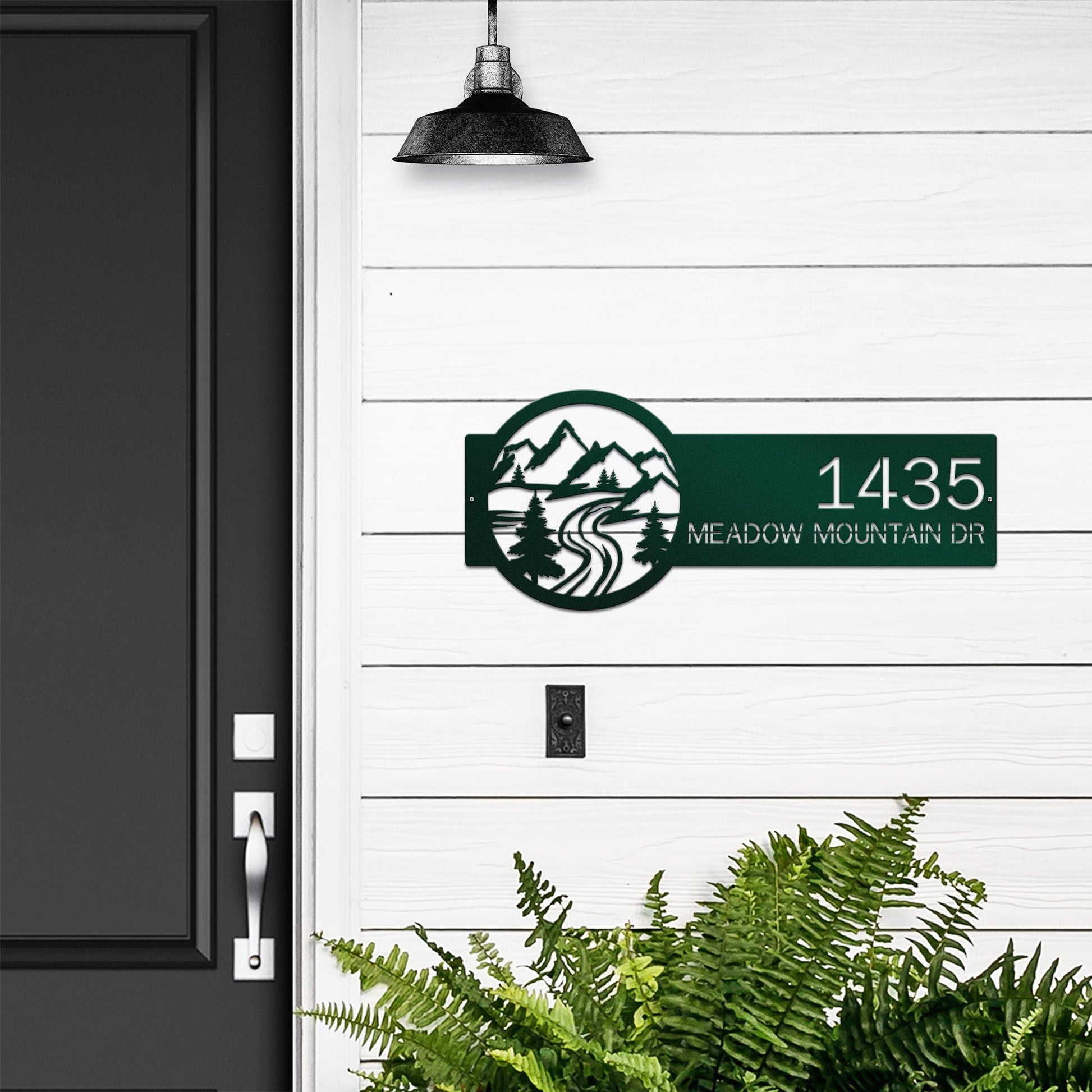 Bionic green Mountain Monogram Address Sign with mountain, pine tree, and rode on right, house number '1435 Meadow Mountain Dr' left.