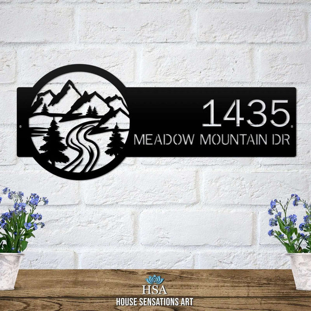 Satin black Mountain Monogram Address Sign with mountain, pine tree, and  rode  on right, house number '1435 Meadow Mountain Dr' left.