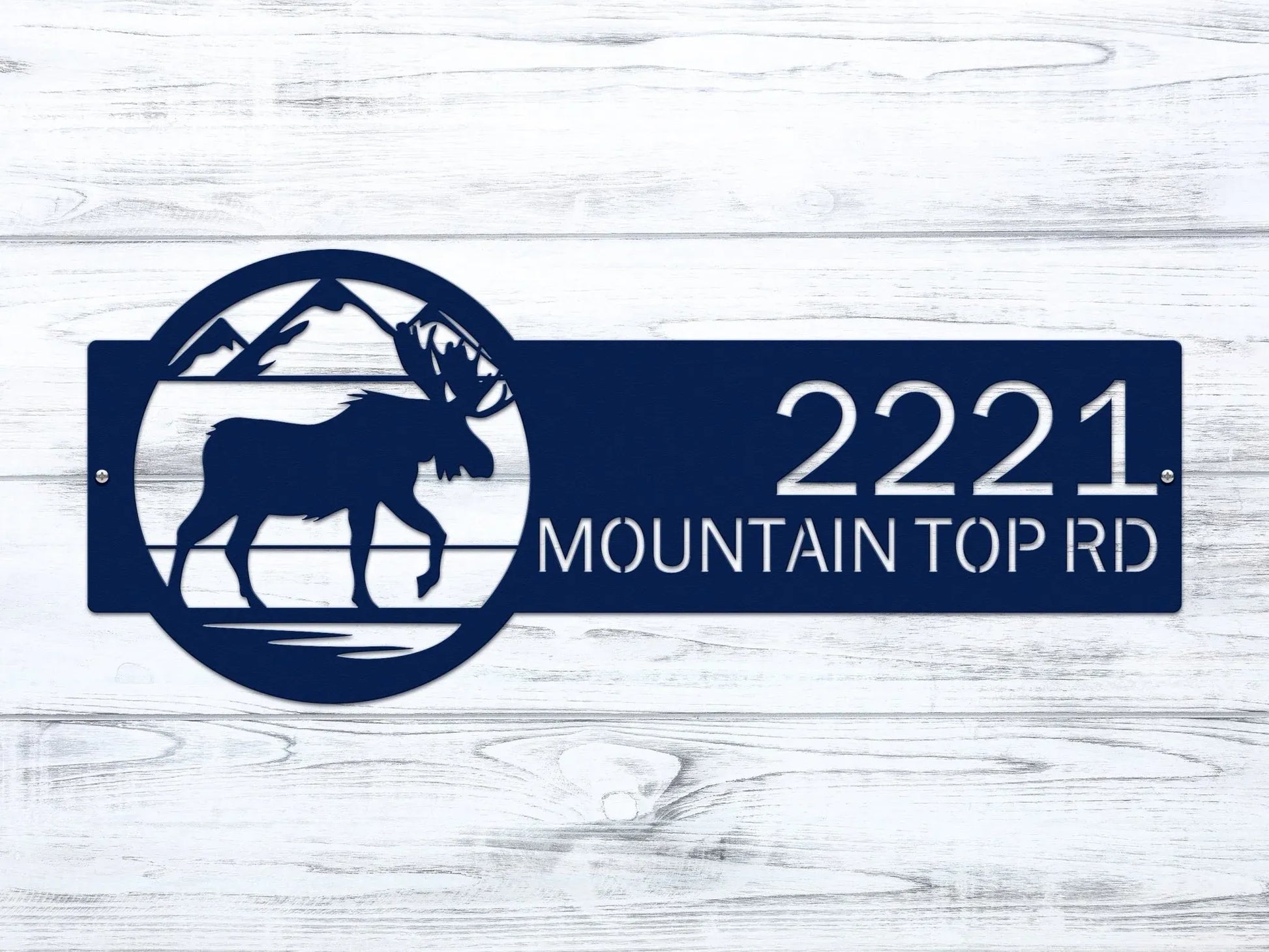 Close-up of navy blue Mountain Moose Address Sign with moose and mountain on right and house number '2221 Mountain Top Rd'.