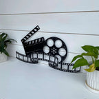 movie-reel-wall-decor-personalized-metal-art-for-film-lovers-home-theaters-black-display-white-wall-house-sensations-art.jpg