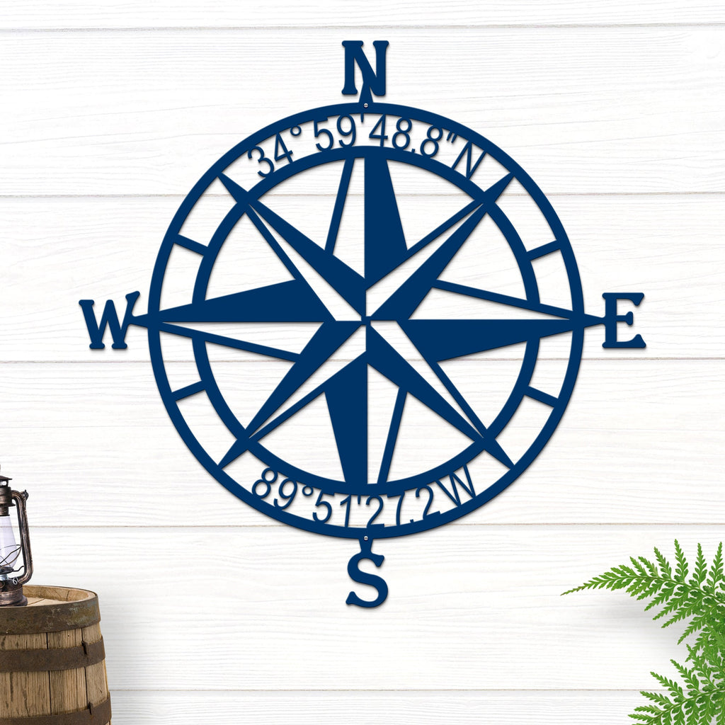 Decorative nautical compass rose metal wall art on white wooden background with lantern and plant, coastal décor, HouseSensationsArt