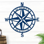 Decorative nautical compass rose metal wall art on white wooden background with lantern and plant, coastal décor, HouseSensationsArt