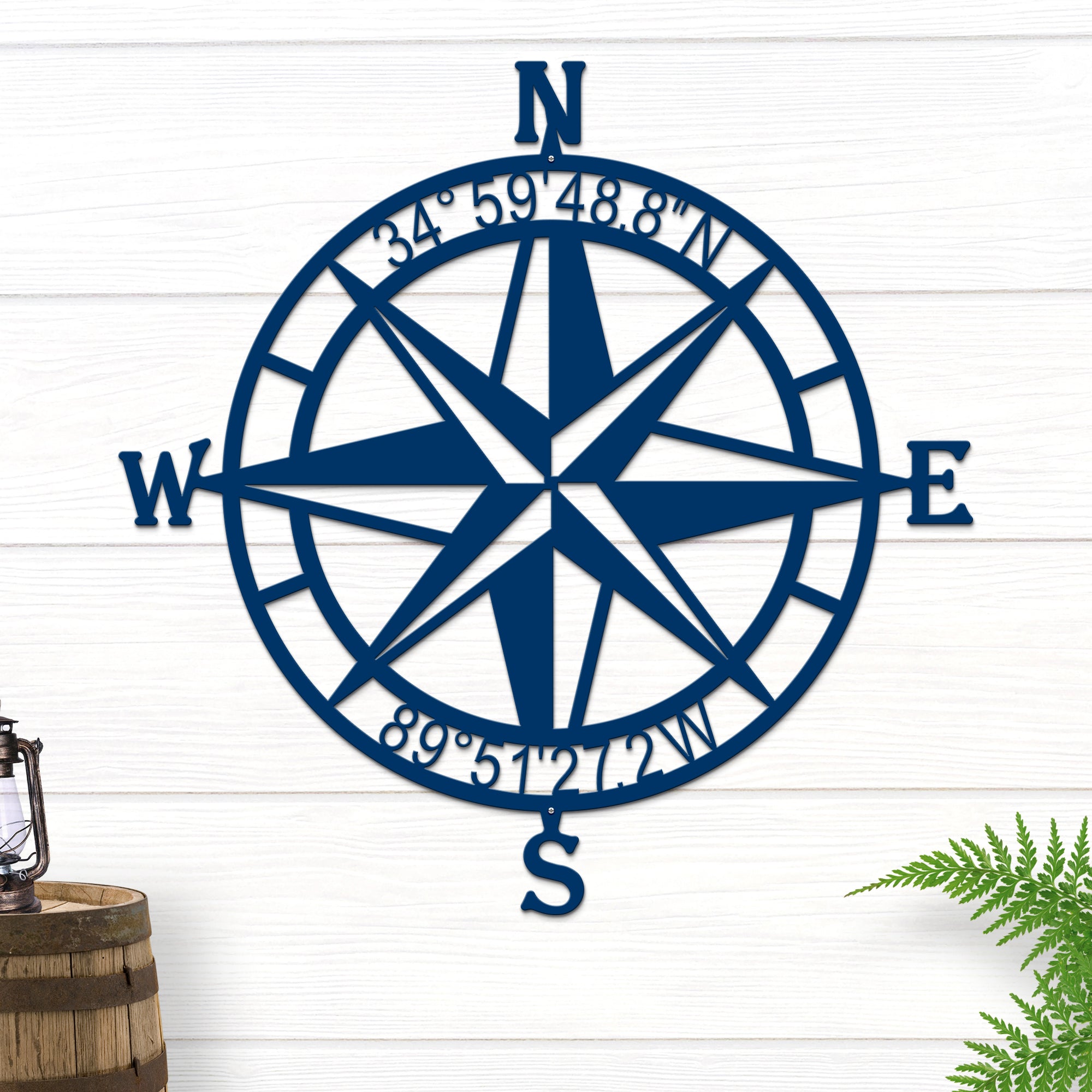 Decorative nautical compass rose metal wall art on white wooden background with lantern and plant, coastal décor, HouseSensationsArt