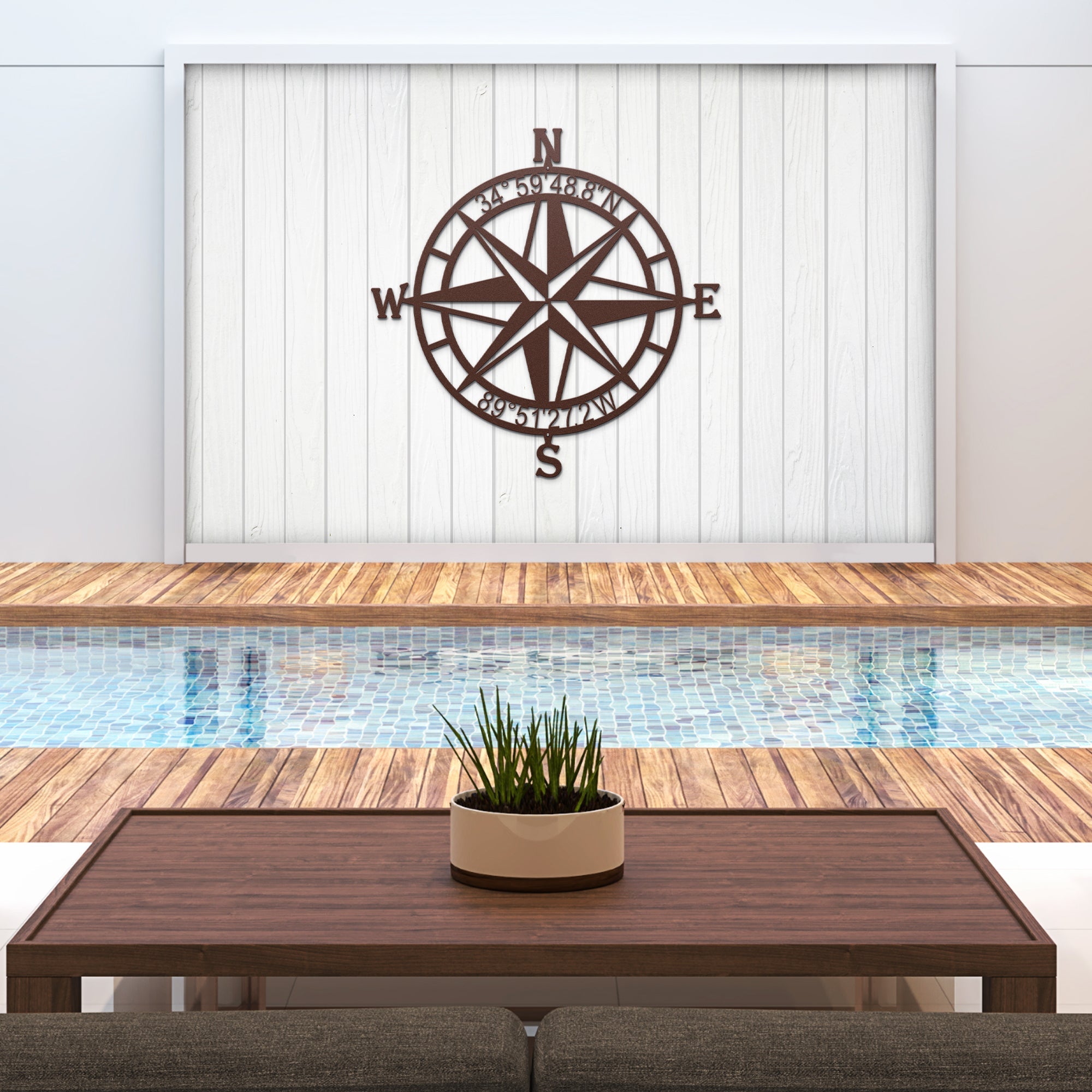 Decorative nautical compass rose metal wall art mounted above pool with wooden deck, coastal outdoor décor, HouseSensationsArt