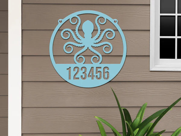 Round Arizona turquoise Address Sign with house number '123456' and octopus design, mounted on door wall.