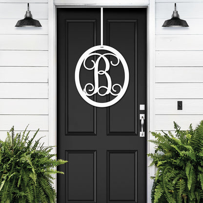 White oval monogram wreath on black door – elegant front door decor in custom metal art